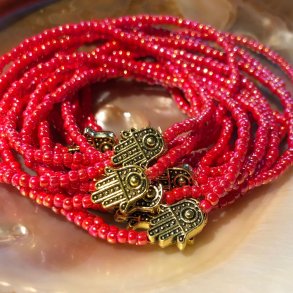 Pink armbnd med hamsa hnd